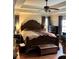 Spacious main bedroom with large bed and hardwood floors at 165 Summit Point Dr, Fayetteville, GA 30214