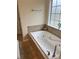Relaxing bathroom with a jetted tub at 165 Summit Point Dr, Fayetteville, GA 30214