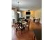 Open concept dining area with hardwood floors and views of the living room and fireplace at 165 Summit Point Dr, Fayetteville, GA 30214
