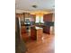 Island kitchen with granite countertops, wooden cabinets and stainless steel appliances at 165 Summit Point Dr, Fayetteville, GA 30214
