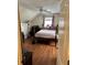 Cozy bedroom featuring a double bed and hardwood floors at 165 Summit Point Dr, Fayetteville, GA 30214