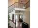 Elegant staircase with wrought-iron balusters leading to the upper level at 165 Summit Point Dr, Fayetteville, GA 30214