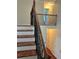 Elegant staircase with wrought iron railing at 165 Summit Point Dr, Fayetteville, GA 30214