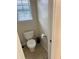 Small bathroom with toilet and window at 165 Summit Point Dr, Fayetteville, GA 30214