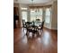 Bright dining area with hardwood floors and a bay window, adjacent to the kitchen at 165 Summit Point Dr, Fayetteville, GA 30214