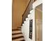 View of the staircase with wooden steps and wrought iron railings at 165 Summit Point Dr, Fayetteville, GA 30214