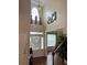 Two story foyer with hardwood floors and decorative wall art at 165 Summit Point Dr, Fayetteville, GA 30214