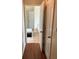 View into bathroom with tub and hardwood floors at 165 Summit Point Dr, Fayetteville, GA 30214