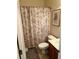 Clean bathroom with a shower/tub combo, wood vanity, and neutral color palette at 165 Summit Point Dr, Fayetteville, GA 30214