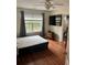 Bright bedroom with large bed and hardwood floors at 165 Summit Point Dr, Fayetteville, GA 30214