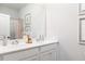 Double vanity bathroom with modern white cabinets at 320 Lavender Ln, Holly Springs, GA 30115