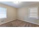 Bright bedroom with neutral walls and carpet flooring at 6168 Ellis St, Douglasville, GA 30134