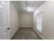 Simple bedroom with carpet and large window at 6168 Ellis St, Douglasville, GA 30134