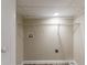 Basement laundry area with wire shelving for storage at 6168 Ellis St, Douglasville, GA 30134
