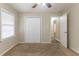 Bright bedroom featuring neutral carpeting and double door closet at 6168 Ellis St, Douglasville, GA 30134