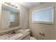 Clean bathroom with granite countertop, single sink, and updated fixtures at 6168 Ellis St, Douglasville, GA 30134