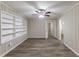 Living room with built-in shelving and ceiling fan at 6168 Ellis St, Douglasville, GA 30134