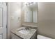 Updated bathroom with granite vanity and a large mirror at 6168 Ellis St, Douglasville, GA 30134