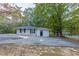 House exterior with a detached garage at 6168 Ellis St, Douglasville, GA 30134