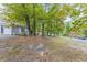 Ranch home with mature trees and a spacious front yard at 6168 Ellis St, Douglasville, GA 30134