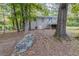 Back exterior view, showcasing a deck and large yard at 6168 Ellis St, Douglasville, GA 30134