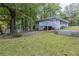 House exterior featuring a deck and landscaped yard at 6168 Ellis St, Douglasville, GA 30134