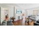 Spacious living room with hardwood floors, fireplace, and ample natural light at 1618 Belmont Sw Ave, Atlanta, GA 30310