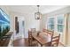 Bright dining room with a farmhouse table and a view into the kitchen at 1618 Belmont Sw Ave, Atlanta, GA 30310