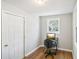 Home office with wood flooring, a window, and a simple workspace at 1618 Belmont Sw Ave, Atlanta, GA 30310