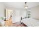 Spacious bedroom with hardwood floors and access to hallway at 1618 Belmont Sw Ave, Atlanta, GA 30310