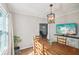 Dining room featuring a rustic wooden table and a large window at 1618 Belmont Sw Ave, Atlanta, GA 30310