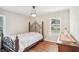 Bedroom with hardwood floors and a comfortable bed at 1618 Belmont Sw Ave, Atlanta, GA 30310