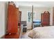 Main bedroom with hardwood floors and large dresser at 1618 Belmont Sw Ave, Atlanta, GA 30310