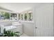 Bright laundry room with washer, dryer, and exterior access at 1618 Belmont Sw Ave, Atlanta, GA 30310