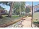 Large backyard with grass, trees, and playset at 1618 Belmont Sw Ave, Atlanta, GA 30310