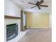 Gathering room with white brick fireplace and ceiling fan at 1996 Walton Woods Cir, Tucker, GA 30084