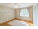 Charming bedroom with hardwood floors, window, and built-in closet at 1996 Walton Woods Cir, Tucker, GA 30084