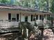 White ranch house with covered porch and ramp at 430 Poole Bridge Rd, Hiram, GA 30141