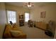 Bright bedroom with a sofa, desk, and plenty of natural light at 1025 Copper Creek Dr, Canton, GA 30114