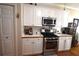 Modern kitchen with stainless steel appliances and white cabinets at 1025 Copper Creek Dr, Canton, GA 30114