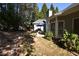Landscaped backyard with a patio and lush greenery at 1025 Copper Creek Dr, Canton, GA 30114