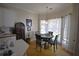 Bright kitchen nook with a table and chairs, overlooking the backyard at 1025 Copper Creek Dr, Canton, GA 30114