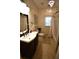 Elegant bathroom with a large vanity, shower, and tiled floor at 1025 Copper Creek Dr, Canton, GA 30114