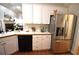 Kitchen features stainless steel appliances and ample white cabinetry at 1025 Copper Creek Dr, Canton, GA 30114