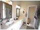 Double vanity bathroom with a shower and a separate tub at 1025 Copper Creek Dr, Canton, GA 30114