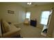 Spacious bedroom with a sofa, chair, and ample closet space at 1025 Copper Creek Dr, Canton, GA 30114