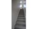 Carpeted staircase leading to the upper level at 1025 Copper Creek Dr, Canton, GA 30114