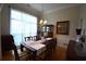 Bright dining room with lace curtains and a large window at 1025 Copper Creek Dr, Canton, GA 30114