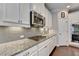 Granite countertops and white cabinets in kitchen at 368 Sawyer Meadow Way, Grayson, GA 30017