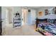 bedroom with twin bed, shelf, and access to bathroom at 2286 Noelle Pl, Powder Springs, GA 30127